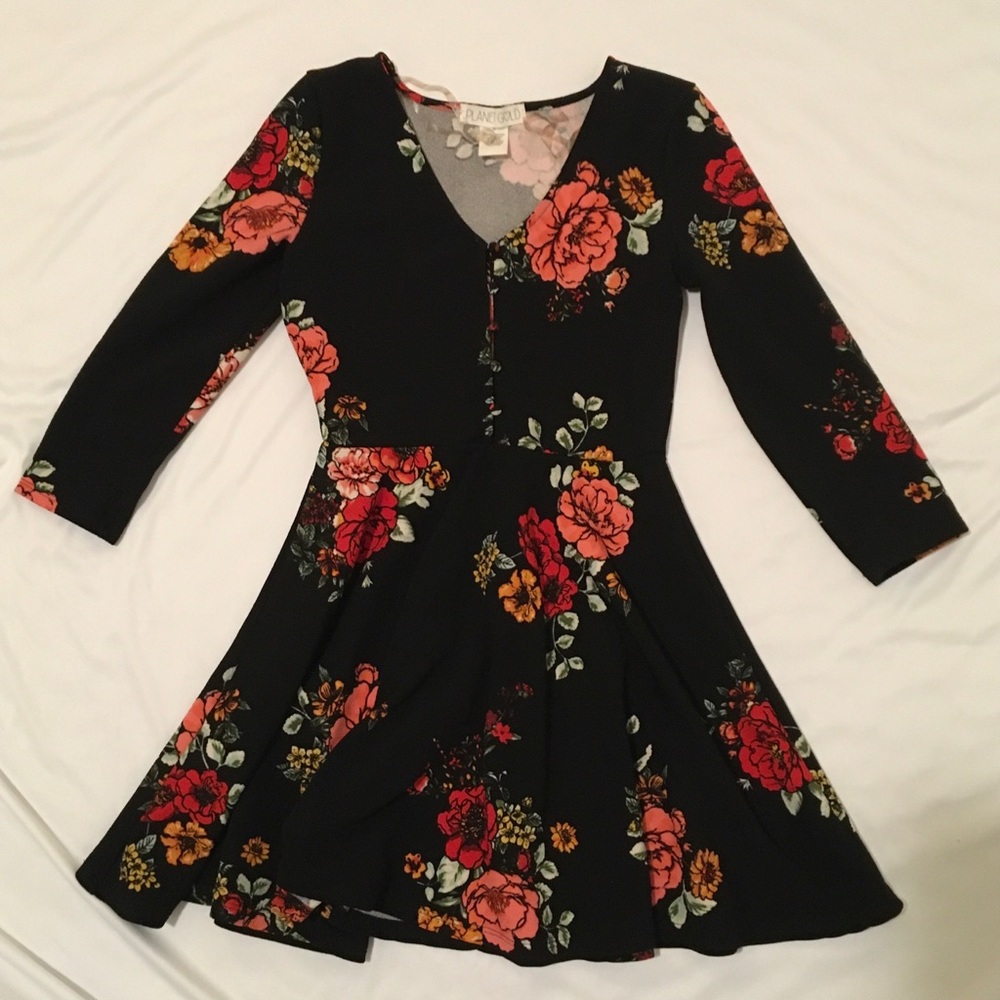Black floral babydoll dress with 3/4 sleeves and button-up front